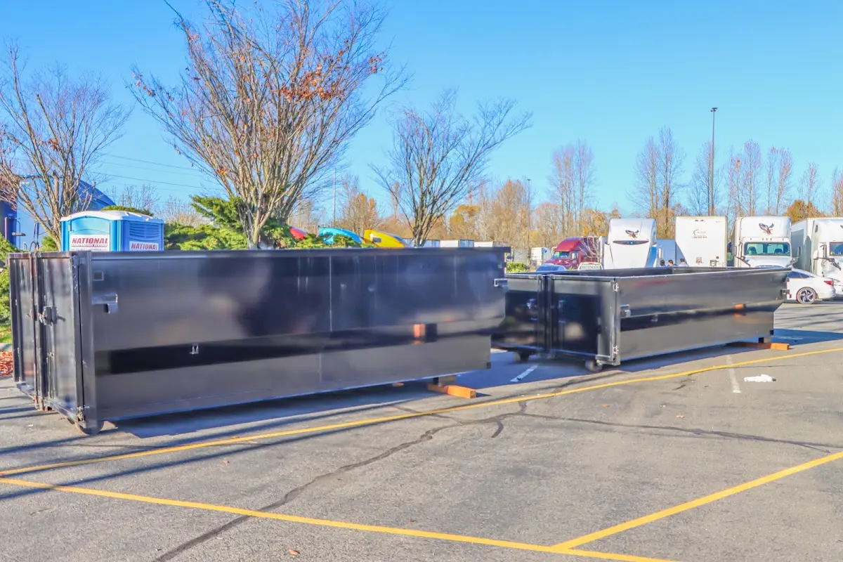 Professional dumpster rental service with roll-off container on residential driveway in Lisle